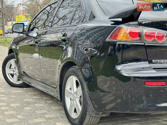 Черный Мицубиси Лансер, объемом двигателя 2 л и пробегом 221 тыс. км за 6750 $, фото 16 на Automoto.ua