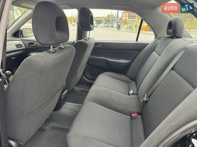 Чорний Міцубісі Lancer, об'ємом двигуна 1.58 л та пробігом 128 тис. км за 5999 $, фото 24 на Automoto.ua