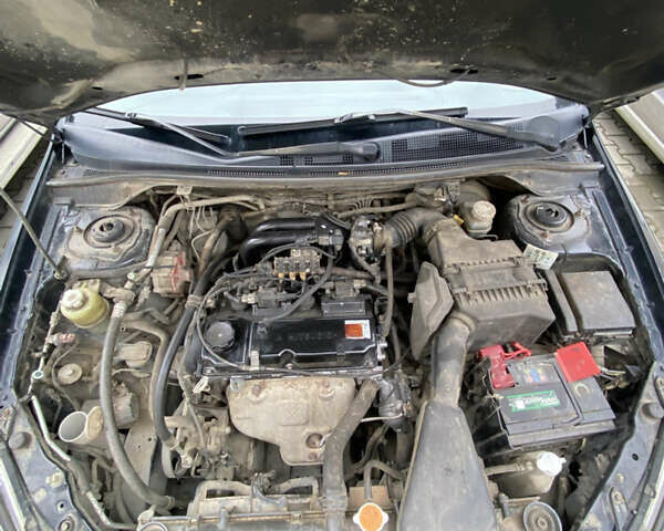 Чорний Міцубісі Lancer, об'ємом двигуна 1.58 л та пробігом 287 тис. км за 4750 $, фото 15 на Automoto.ua