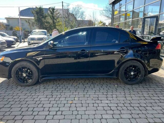 Черный Мицубиси Лансер, объемом двигателя 2 л и пробегом 215 тыс. км за 7000 $, фото 3 на Automoto.ua