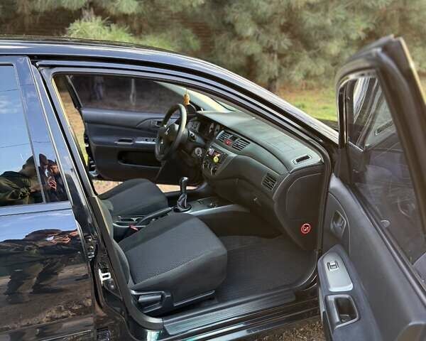 Чорний Міцубісі Lancer, об'ємом двигуна 1.6 л та пробігом 98 тис. км за 5600 $, фото 21 на Automoto.ua
