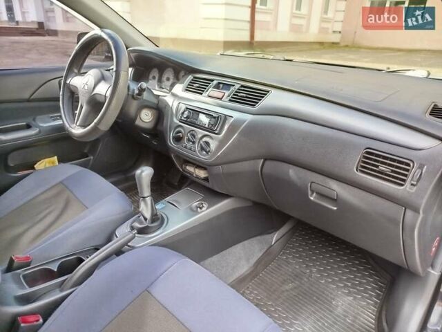 Черный Мицубиси Лансер, объемом двигателя 1.58 л и пробегом 78 тыс. км за 6500 $, фото 25 на Automoto.ua