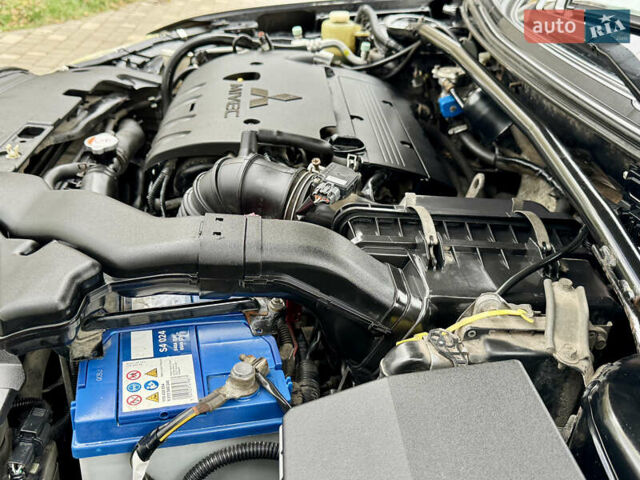 Черный Мицубиси Лансер, объемом двигателя 2 л и пробегом 221 тыс. км за 6750 $, фото 29 на Automoto.ua
