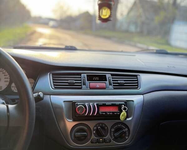 Чорний Міцубісі Lancer, об'ємом двигуна 1.6 л та пробігом 98 тис. км за 5600 $, фото 24 на Automoto.ua