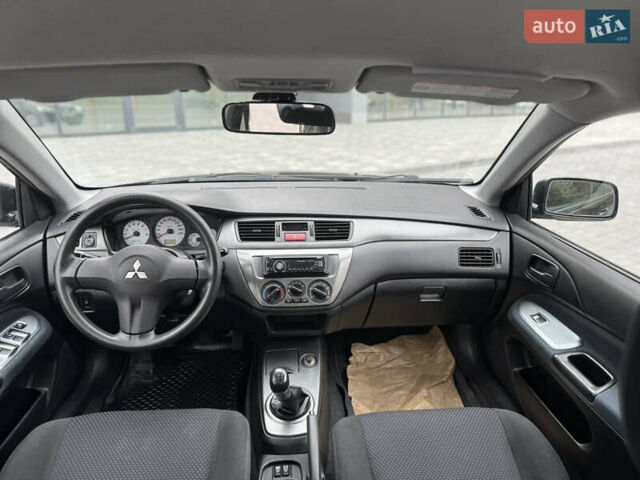 Чорний Міцубісі Lancer, об'ємом двигуна 1.58 л та пробігом 128 тис. км за 5999 $, фото 25 на Automoto.ua
