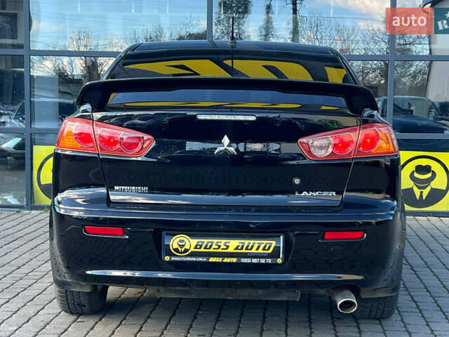 Черный Мицубиси Лансер, объемом двигателя 2 л и пробегом 215 тыс. км за 7000 $, фото 5 на Automoto.ua