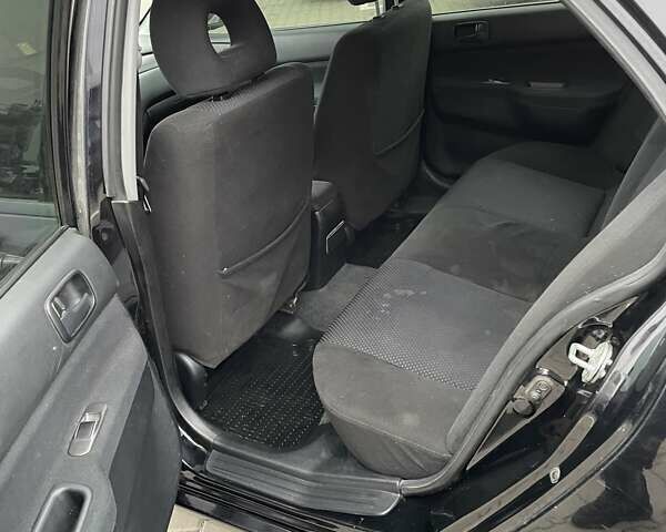 Чорний Міцубісі Lancer, об'ємом двигуна 1.6 л та пробігом 186 тис. км за 5500 $, фото 11 на Automoto.ua