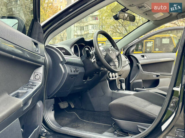 Черный Мицубиси Лансер, объемом двигателя 2 л и пробегом 221 тыс. км за 6750 $, фото 37 на Automoto.ua