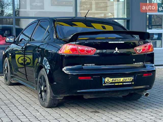 Черный Мицубиси Лансер, объемом двигателя 2 л и пробегом 215 тыс. км за 7000 $, фото 4 на Automoto.ua