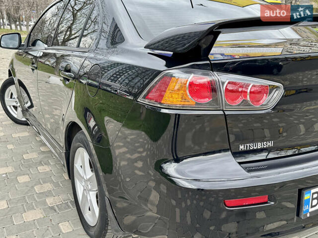 Черный Мицубиси Лансер, объемом двигателя 2 л и пробегом 221 тыс. км за 6750 $, фото 18 на Automoto.ua