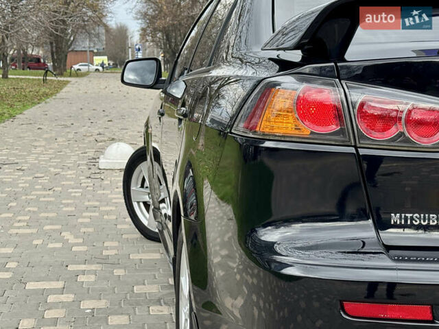 Черный Мицубиси Лансер, объемом двигателя 2 л и пробегом 221 тыс. км за 6750 $, фото 17 на Automoto.ua