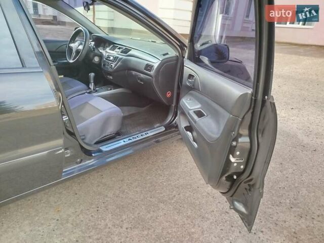 Черный Мицубиси Лансер, объемом двигателя 1.58 л и пробегом 78 тыс. км за 6500 $, фото 20 на Automoto.ua