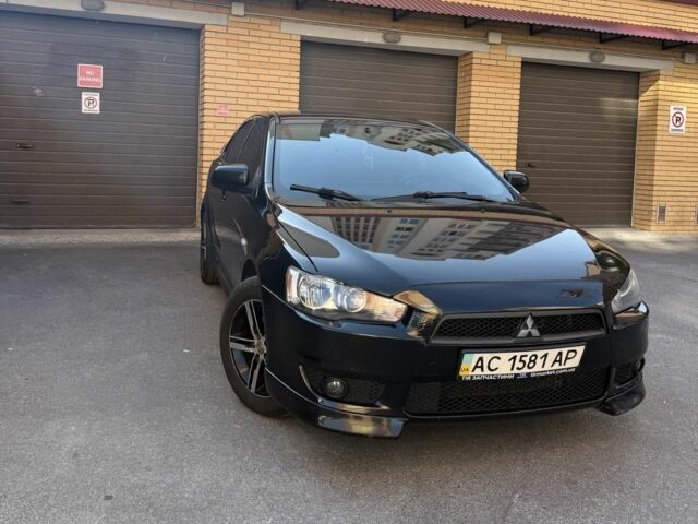 Чорний Міцубісі Lancer, об'ємом двигуна 2 л та пробігом 209 тис. км за 7600 $, фото 1 на Automoto.ua