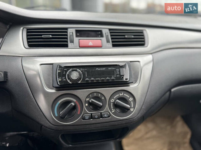 Чорний Міцубісі Lancer, об'ємом двигуна 1.58 л та пробігом 128 тис. км за 5999 $, фото 14 на Automoto.ua
