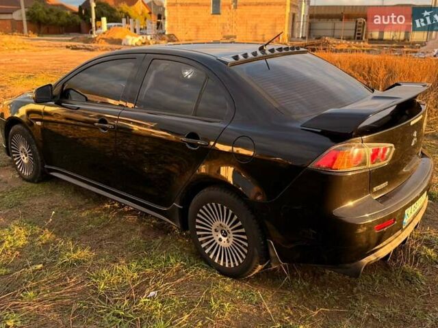 Чорний Міцубісі Lancer, об'ємом двигуна 2 л та пробігом 204 тис. км за 7500 $, фото 3 на Automoto.ua