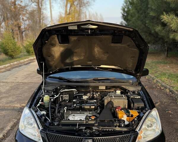 Чорний Міцубісі Lancer, об'ємом двигуна 1.6 л та пробігом 98 тис. км за 5600 $, фото 17 на Automoto.ua