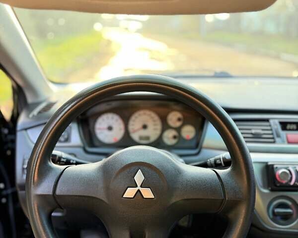 Чорний Міцубісі Lancer, об'ємом двигуна 1.6 л та пробігом 98 тис. км за 5600 $, фото 26 на Automoto.ua