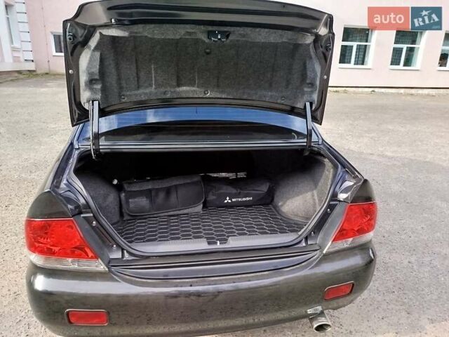 Черный Мицубиси Лансер, объемом двигателя 1.58 л и пробегом 78 тыс. км за 6500 $, фото 19 на Automoto.ua