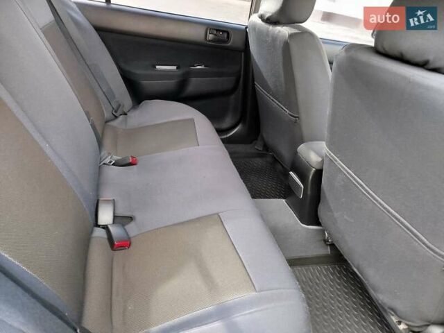 Черный Мицубиси Лансер, объемом двигателя 1.58 л и пробегом 78 тыс. км за 6500 $, фото 21 на Automoto.ua