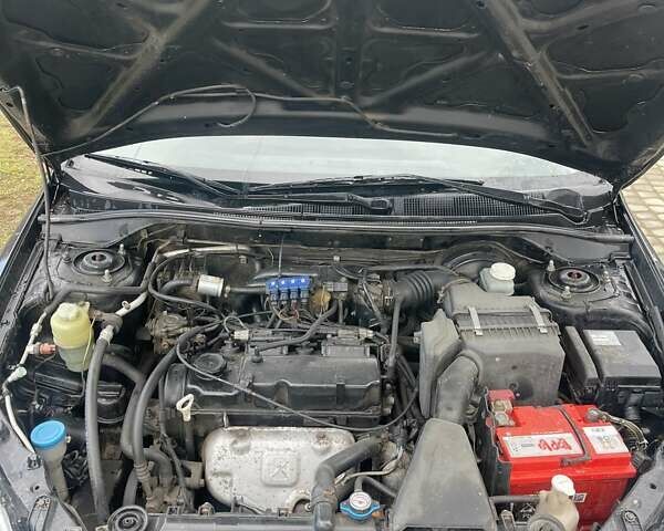 Чорний Міцубісі Lancer, об'ємом двигуна 1.59 л та пробігом 309 тис. км за 3900 $, фото 13 на Automoto.ua