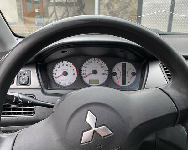 Чорний Міцубісі Lancer, об'ємом двигуна 1.58 л та пробігом 287 тис. км за 4750 $, фото 10 на Automoto.ua