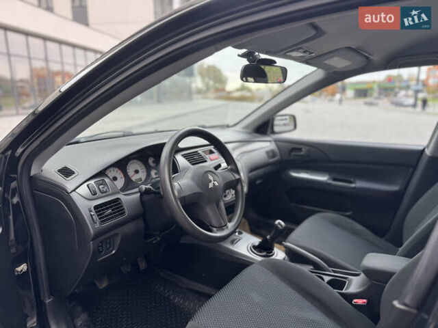 Чорний Міцубісі Lancer, об'ємом двигуна 1.58 л та пробігом 128 тис. км за 5999 $, фото 18 на Automoto.ua