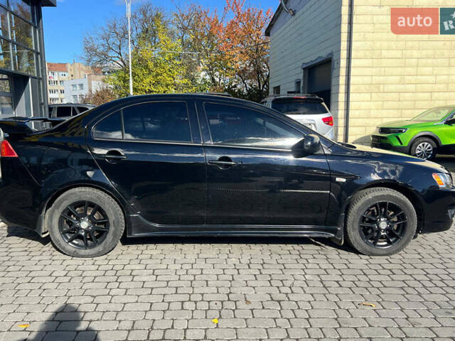 Черный Мицубиси Лансер, объемом двигателя 2 л и пробегом 215 тыс. км за 7000 $, фото 7 на Automoto.ua