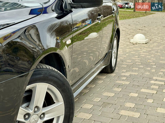 Черный Мицубиси Лансер, объемом двигателя 2 л и пробегом 221 тыс. км за 6750 $, фото 6 на Automoto.ua