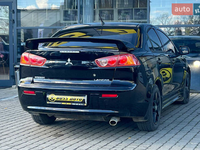 Черный Мицубиси Лансер, объемом двигателя 2 л и пробегом 215 тыс. км за 7000 $, фото 6 на Automoto.ua
