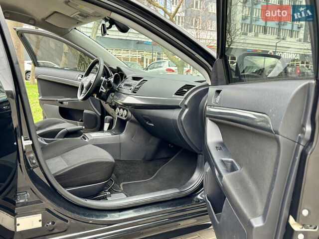 Черный Мицубиси Лансер, объемом двигателя 2 л и пробегом 221 тыс. км за 6750 $, фото 33 на Automoto.ua