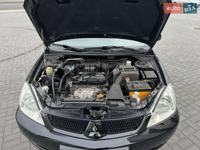 Чорний Міцубісі Lancer, об'ємом двигуна 1.58 л та пробігом 128 тис. км за 5999 $, фото 32 на Automoto.ua