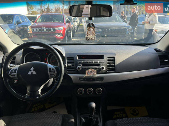 Черный Мицубиси Лансер, объемом двигателя 2 л и пробегом 215 тыс. км за 7000 $, фото 13 на Automoto.ua