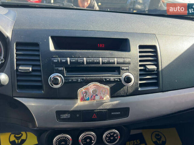 Черный Мицубиси Лансер, объемом двигателя 2 л и пробегом 215 тыс. км за 7000 $, фото 11 на Automoto.ua