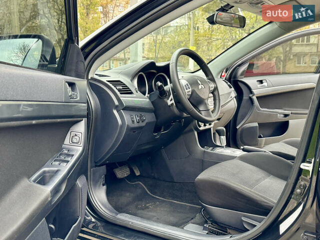 Черный Мицубиси Лансер, объемом двигателя 2 л и пробегом 221 тыс. км за 6750 $, фото 36 на Automoto.ua