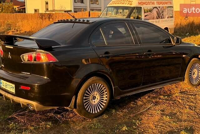 Чорний Міцубісі Lancer, об'ємом двигуна 2 л та пробігом 204 тис. км за 7500 $, фото 2 на Automoto.ua