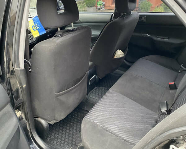 Чорний Міцубісі Lancer, об'ємом двигуна 1.58 л та пробігом 287 тис. км за 4750 $, фото 7 на Automoto.ua