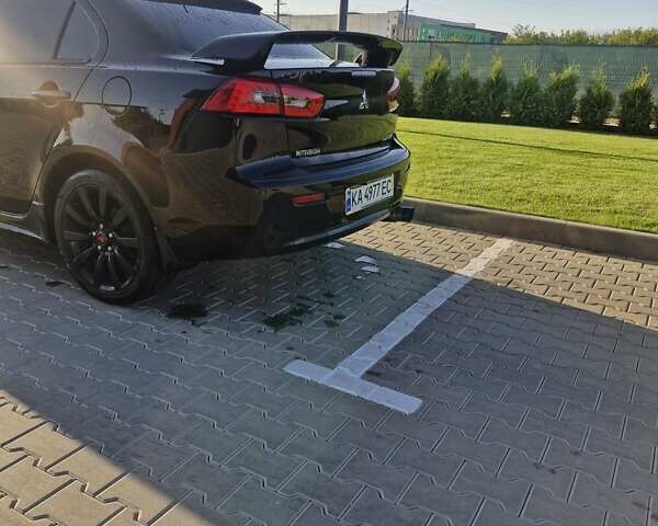 Черный Мицубиси Лансер, объемом двигателя 2 л и пробегом 184 тыс. км за 6999 $, фото 10 на Automoto.ua