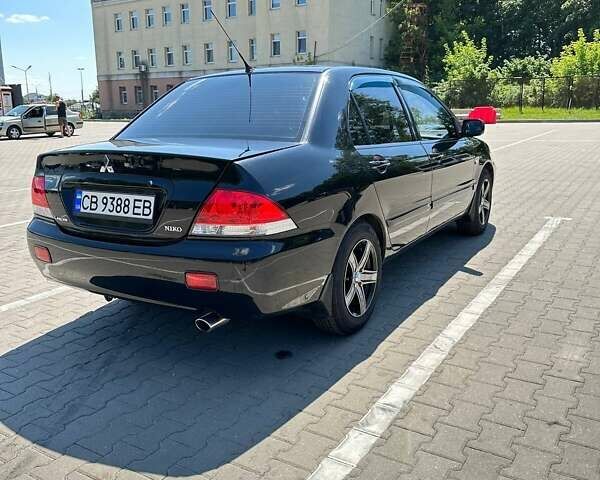 Чорний Міцубісі Lancer, об'ємом двигуна 1.6 л та пробігом 138 тис. км за 5500 $, фото 6 на Automoto.ua