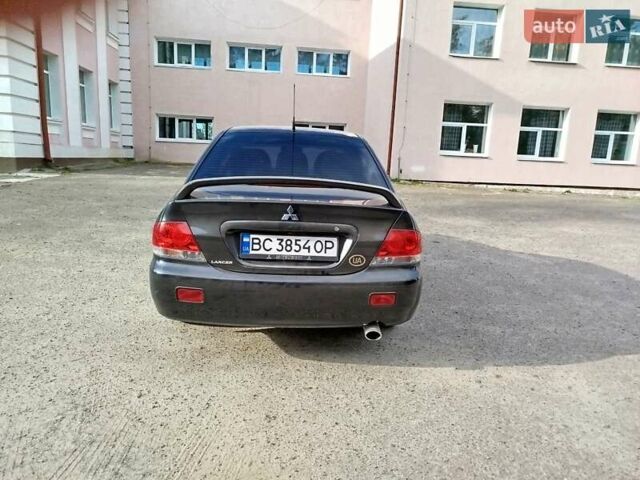 Черный Мицубиси Лансер, объемом двигателя 1.58 л и пробегом 78 тыс. км за 6500 $, фото 2 на Automoto.ua