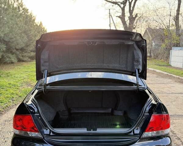 Чорний Міцубісі Lancer, об'ємом двигуна 1.6 л та пробігом 98 тис. км за 5600 $, фото 9 на Automoto.ua