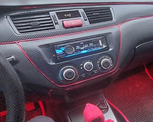 Чорний Міцубісі Lancer, об'ємом двигуна 1.58 л та пробігом 345 тис. км за 4500 $, фото 3 на Automoto.ua