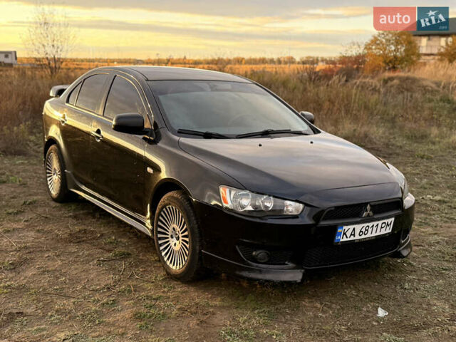 Чорний Міцубісі Lancer, об'ємом двигуна 2 л та пробігом 204 тис. км за 7500 $, фото 1 на Automoto.ua