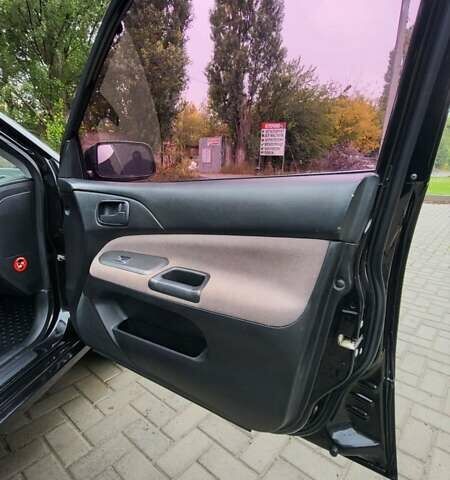 Черный Мицубиси Лансер, объемом двигателя 1.6 л и пробегом 290 тыс. км за 4350 $, фото 16 на Automoto.ua