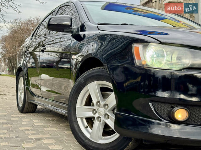 Черный Мицубиси Лансер, объемом двигателя 2 л и пробегом 221 тыс. км за 6750 $, фото 11 на Automoto.ua