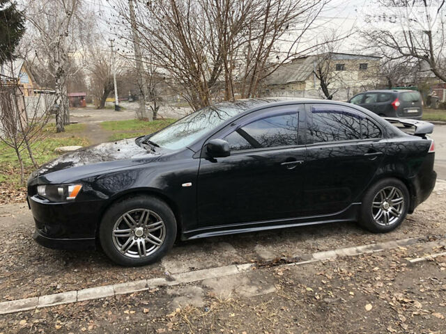 Чорний Міцубісі Lancer, об'ємом двигуна 2 л та пробігом 138 тис. км за 7500 $, фото 10 на Automoto.ua