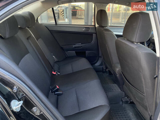 Чорний Міцубісі Lancer, об'ємом двигуна 1.5 л та пробігом 203 тис. км за 6250 $, фото 27 на Automoto.ua