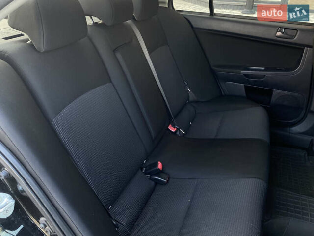 Черный Мицубиси Лансер, объемом двигателя 1.5 л и пробегом 203 тыс. км за 5990 $, фото 25 на Automoto.ua