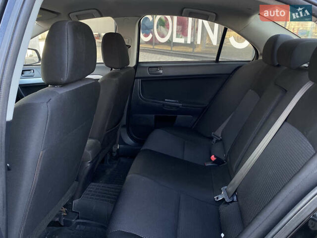 Чорний Міцубісі Lancer, об'ємом двигуна 1.5 л та пробігом 203 тис. км за 6250 $, фото 24 на Automoto.ua