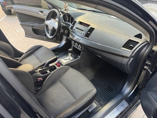 Мицубиси Лансер 2010 в Киеве на Automoto.ua Черный Мицубиси Лансер, объемом двигателя 2 л и пробегом 189 тыс. км за 5700 $, фото 22 на Automoto.ua