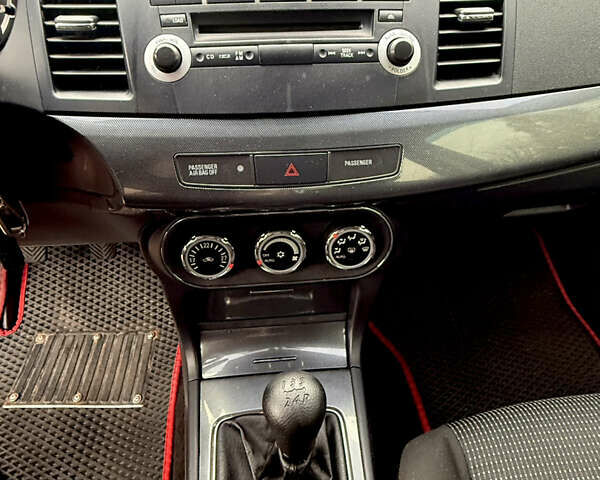 Черный Мицубиси Лансер, объемом двигателя 2 л и пробегом 169 тыс. км за 6800 $, фото 28 на Automoto.ua